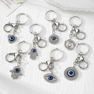 Creative Evil Eye keychains in silver alloy with rhinestones and blue eye charms