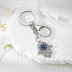 Detail of silver Hamsa Hand keychain with Evil Eye charm and sparkling crystals