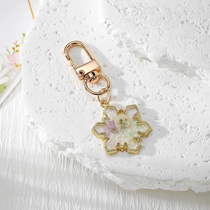 Exquisite snowflake resin keychain with real dried flowers and gold metal finish pendant