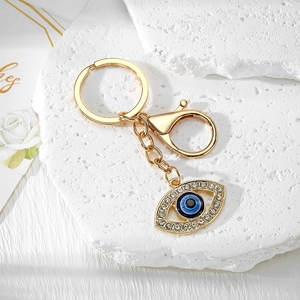 Detailed view of evil eye keychain with gold plating and sparkling rhinestones