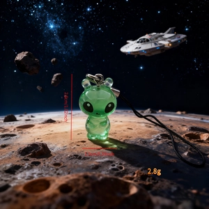 Detailed view of glow-in-the-dark resin alien charm with precise size and weight dimensions