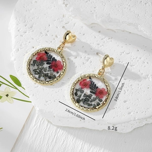 Elegant handmade heart earrings with real red dried flowers in clear resin on white stone