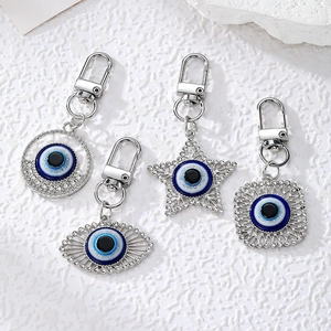 Silver Evil Eye keychain set with sparkling rhinestones in star and circle shapes