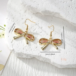 Handmade resin bow earrings with real pink dried flowers and gold stainless steel hooks