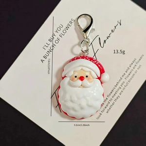 Detailed view of large Santa Claus pendant with silver lobster clasp and resin finish