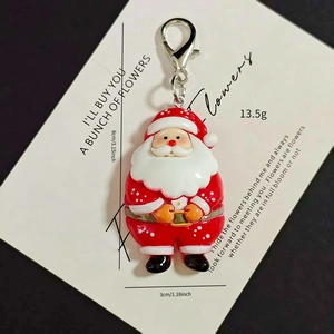 Detailed view of Santa Claus pendant with dimensions 8x3cm and lobster clasp