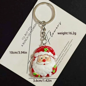 Detail of Santa Claus keychain showing dimensions 10cm and weights 16.2g on card
