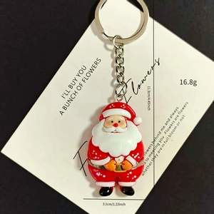 Close-up of Santa Claus keychain with detailed dimensions 3.1cm x 11.3cm and 16.8g weight