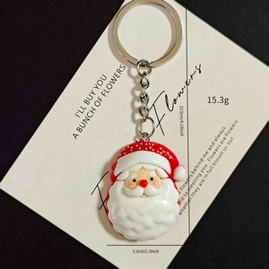 Detailed view of Santa Claus keychain showing dimensions of 10.5cm height and 15.3g weight