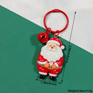 Close-up of Large Santa Claus Keychain with red bell charm and metallic ring