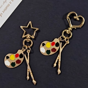 Artistic keychain set with palette and brush charms on star and heart hooks