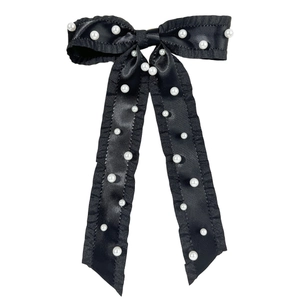Elegant black satin bow hair clip with ruffle edges and white pearls for women