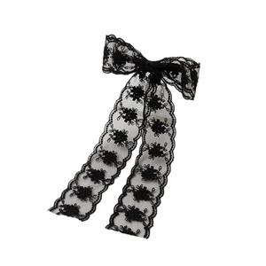 Elegant black lace bow hair clip with long streamers and embroidered floral patterns