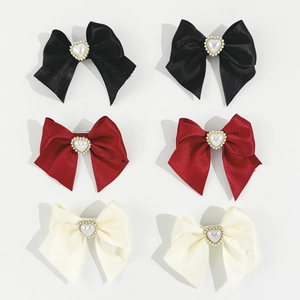 Set of six satin bow hair clips in black, burgundy and cream with heart pearl centerpieces