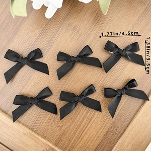 Set of 6 black ballet-style satin bow hair clips for elegant and versatile hair styling