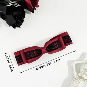 Detail view of gothic red bow hair clip with black lace including size measurements