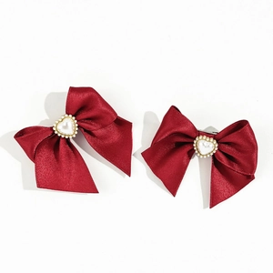 Deep red satin bow hair clips with heart pearl center in elegant vintage style