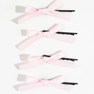 Lot de quatre barrettes à nœuds en ruban rose avec pinces à cheveux en métal noir