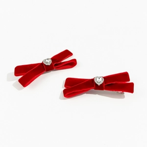 Elegant pair of red velvet bow hair clips with heart-shaped crystal rhinestones