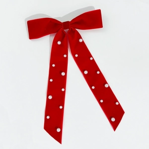 Elegant red velvet bow hair clip with handmade pearls and long flowing ribbons