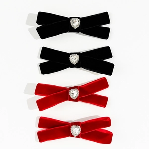Elegant velvet bow hair clips with heart-shaped rhinestones in classic red and black colors