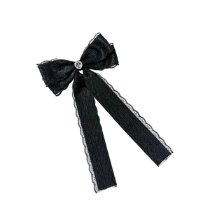 Dark aesthetic black lace bow hair clip with a sparkling rhinestone heart center