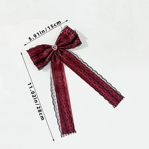 Detailed view of 15x28cm dark red lace bow hair clip with rhinestone heart center