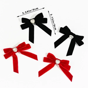 Detailed size view of elegant velvet bow hair clips with heart-shaped crystal centers