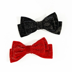 Elegant Christmas velvet bow hair clips in shimmering black and festive red set