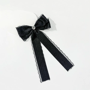 Black lace bow hair clip with a rhinestone heart center and long elegant ribbons