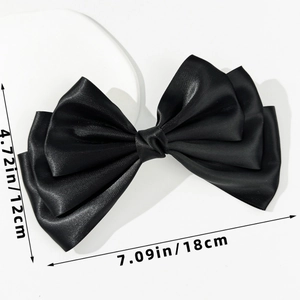 Detailed size view of a large black satin bow hair clip measuring 18cm by 12cm