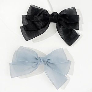 Elegant layered mesh bow hair clips in black and light blue with a soft pearlescent finish