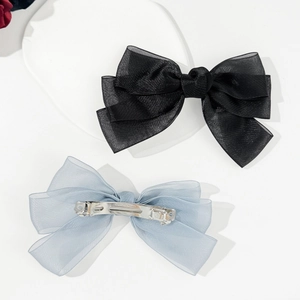 Elegant set of black and light blue organza bow hair clips with metal spring fasteners