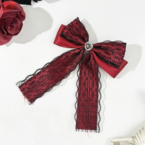 Gothic hair clip with deep red satin, black floral lace, and a heart-shaped grey rhinestone
