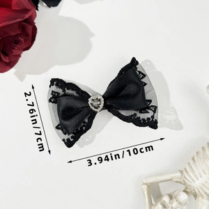 Detailed size view of black lace bow hair clip with heart rhinestone in gothic style