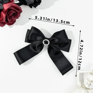Detail showing dimensions of black satin bow hair clip with rhinestone center ornament