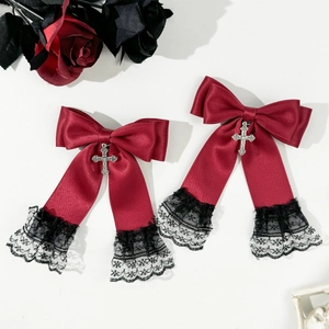 Gothic Lolita red satin bow hair clips with silver crosses and black lace trim on white background