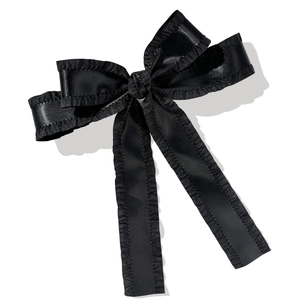 Elegant black satin ribbon hair clip with pleated ruffle edges and long streamers