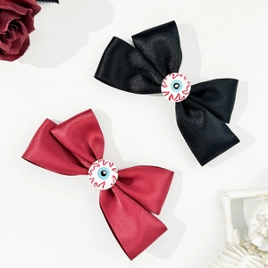 Gothic Halloween hair clips with eyeball bows in black and dark red satin fabric