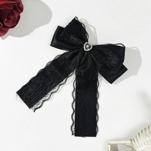 Gothic black satin bow hair clip with lace details and a crystal heart rhinestone pendant