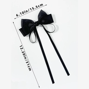 Detail view of black satin bow hair clip showing dimensions 15.5cm width and 31cm length