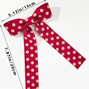 Polka dot ribbon hair clip detail showing 13cm width and 20cm length measurements