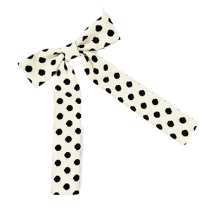 Vintage black and white polka dot bow hair clip with elegant long streamers for women