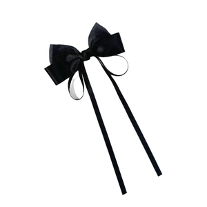 Elegant black satin bow hair clip with long streamers on a clean white background