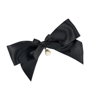 Elegant black satin bow hair clip with white pearl pendant on a clean white background