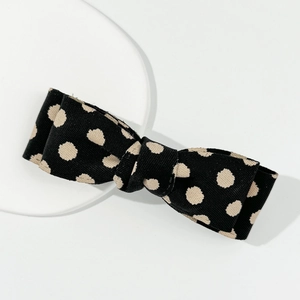 Polka dot bow hair clip in black and apricot ribbed fabric, elegant vintage style hair pin