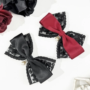Lace bow hair clip set in black and burgundy with elegant pearl charms on white background
