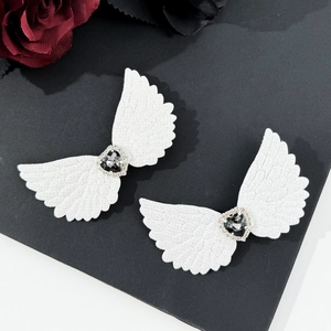 Gothic style angel wing hair clips with black rhinestones and white glitter finish