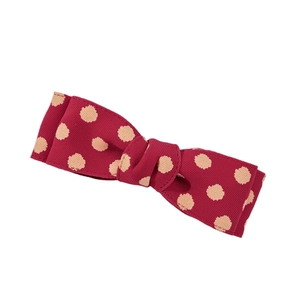Elegant vintage red polka dot bow hair clip crafted from textured grosgrain ribbon fabric