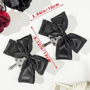 Detail showing gothic black satin bow hair clip with silver cross pendant and measurements